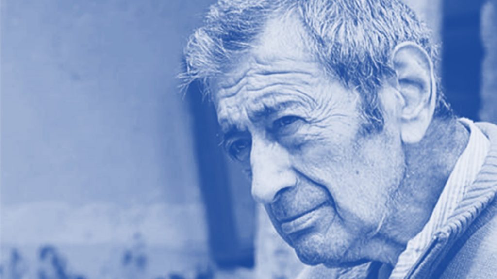 Retrato en tonos azules de Carlos Mellado Molina, escritor chileno de perfil, con expresión reflexiva y mirada